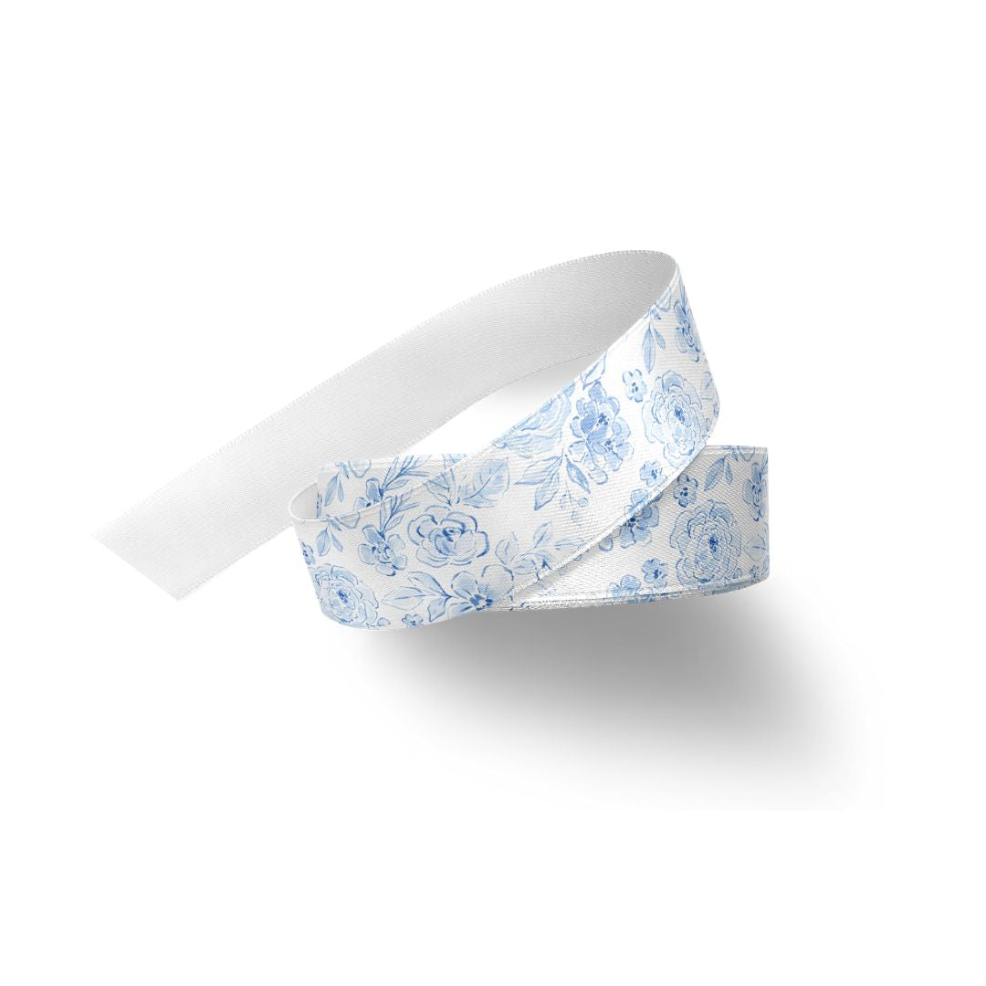 Blue and white coquette floral ribbon on a white background.
