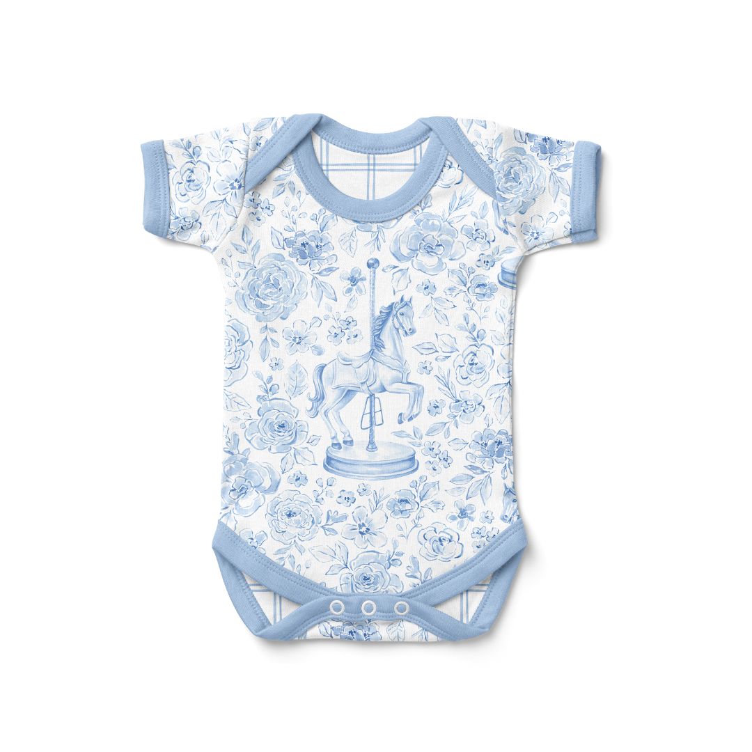 Baby onesie with blue and white carousel design on a white background