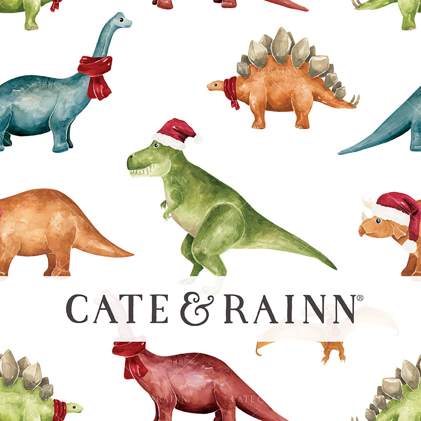 Pattern of colorful dinosaurs with red scarves, Santa hats on a white background, featuring the brand 'Cate &amp; Rainn'.