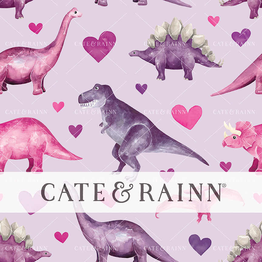 Pattern of pink and purple dinosaurs and hearts with 'Cate &amp; Rainn' branding on a light purple background.