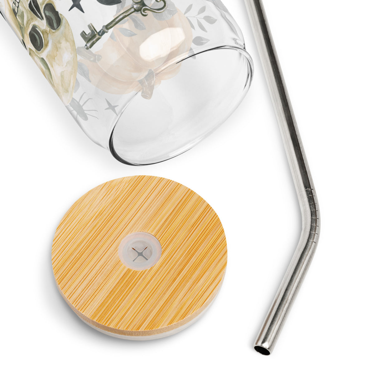 a glass with a straw and a wooden coaster next to it