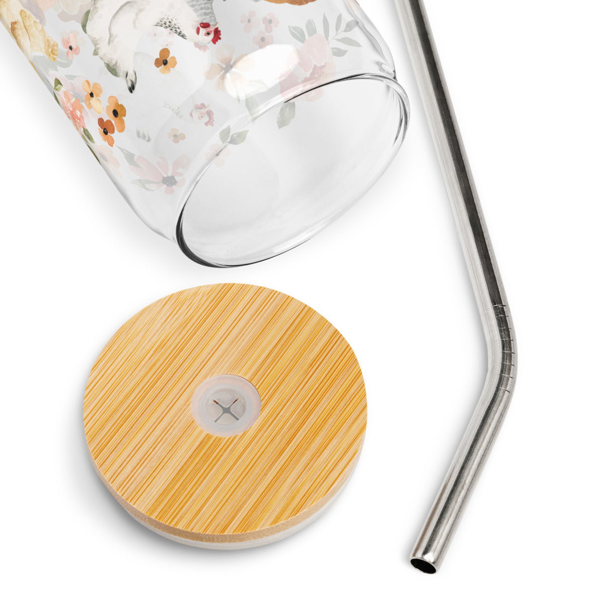 a glass with a straw and a wooden coaster next to it